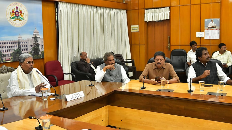 Chief Minister Siddaramaiah chairs a meeting with ministers on Supreme Court order regarding occupancy certificates, in Bengaluru on Monday. Energy Minister K J George, Urban Development Minister Byrathi Suresh and Minister for Municipal Administration Rahim Khan are seen. 