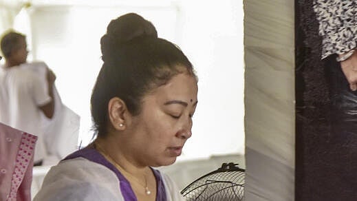 <div class="paragraphs"><p>Garima Saikia Garg (on phone), wife of late singer Zubeen Garg, during 'Adya Shraddha', the first funeral rituals, in Guwahati, Assam, Monday, Sept. 29, 2025.</p></div>