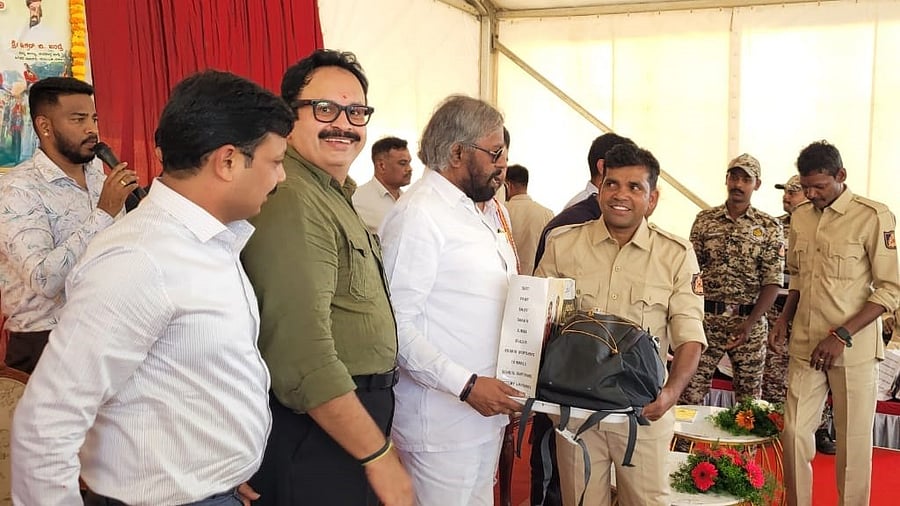 <div class="paragraphs"><p>Eshwar B Khandre presents a kit to the caretakers of Dasara elephants in Mysuru. </p></div>