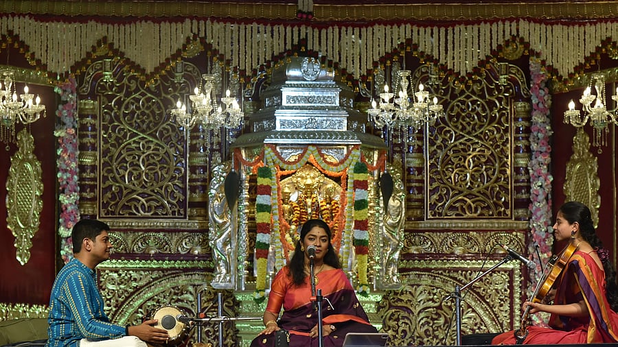Like many Karnatik vocalists, teaching music is the primary source of income for 26-year-oldAkshatha Rudrapatna (centre).