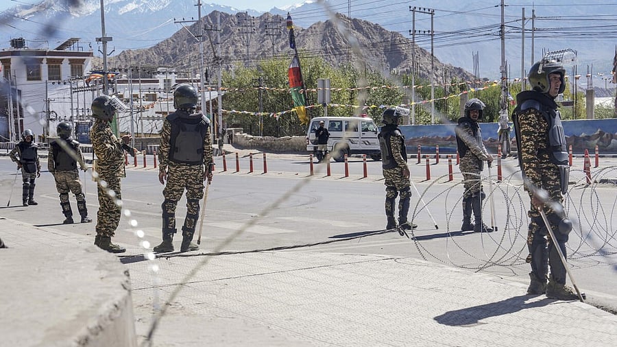 <div class="paragraphs"><p>Security personnel stand guard on a road amid curfew, days after violence during protests for Ladakh statehood, in Leh.</p></div>