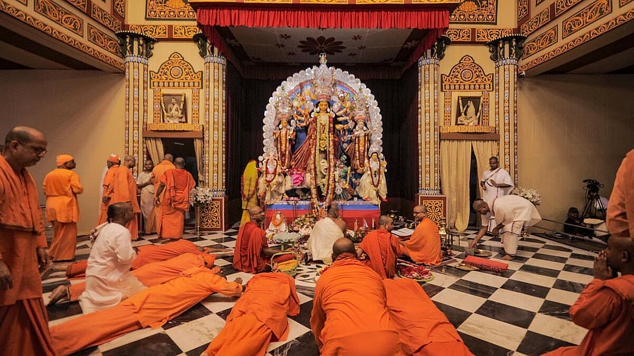 <div class="paragraphs"><p>Monks offer prayers during the 'Kumari Puja' as part of Durga Puja celebrations at Belur Math in Howrah district, West Bengal.</p></div>