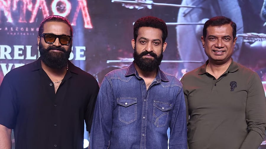<div class="paragraphs"><p>Jr NTR (centre) flanked by actor-director Rishab Shetty and producer Chaluve Gowda.</p></div>