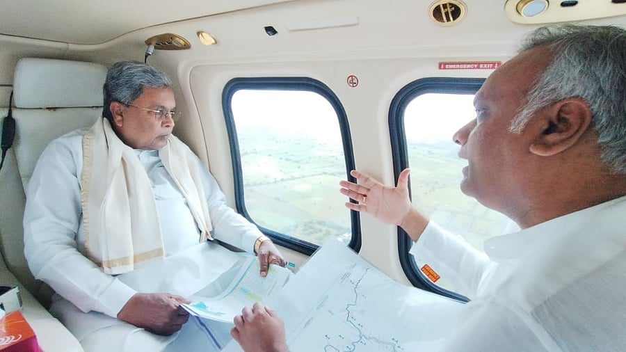 <div class="paragraphs"><p>Chief Minister Siddaramaiah along with Kalaburagi district in-charge Minister Priyank Kharge  during the aerial survey on Tuesday.</p></div>