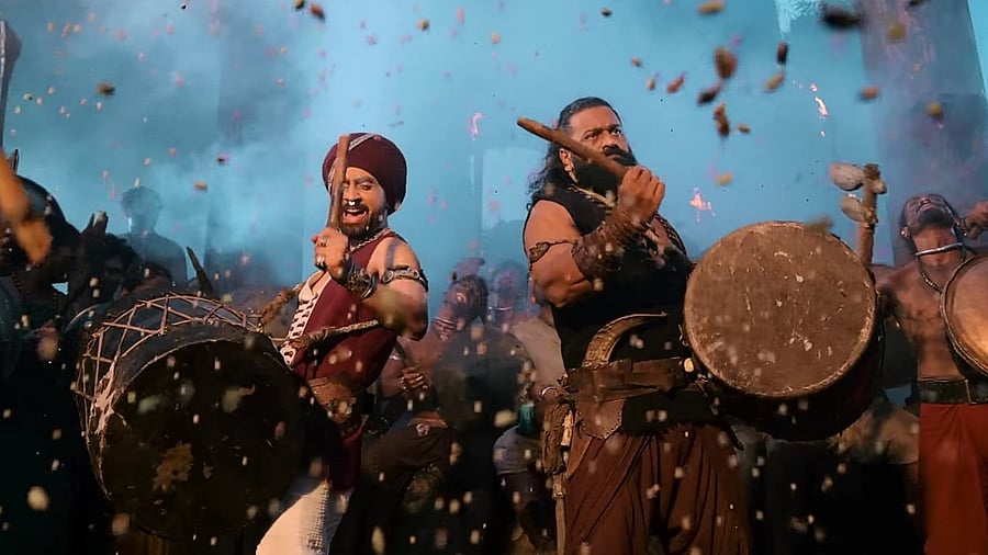 <div class="paragraphs"><p>Diljit Dosanjh and Rishab Shetty in the 'Rebel' song from <em>Kantara: Chapter 1.</em></p></div>