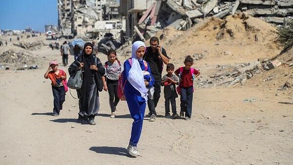 <div class="paragraphs"><p>Palestinians flee Gaza City following an Israeli evacuation order.</p></div>