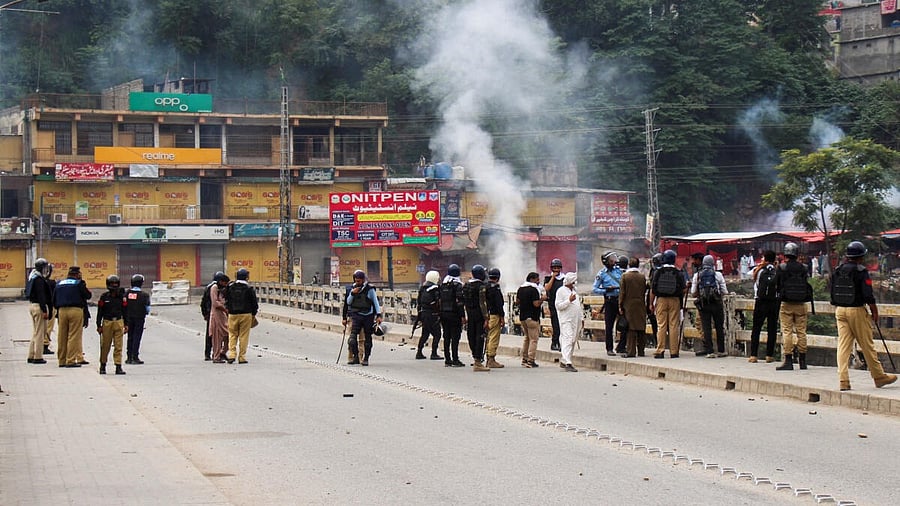 <div class="paragraphs"><p>Photos from Muzaffarabad showed riot police firing tear gas on a bridge on Wednesday.</p></div>