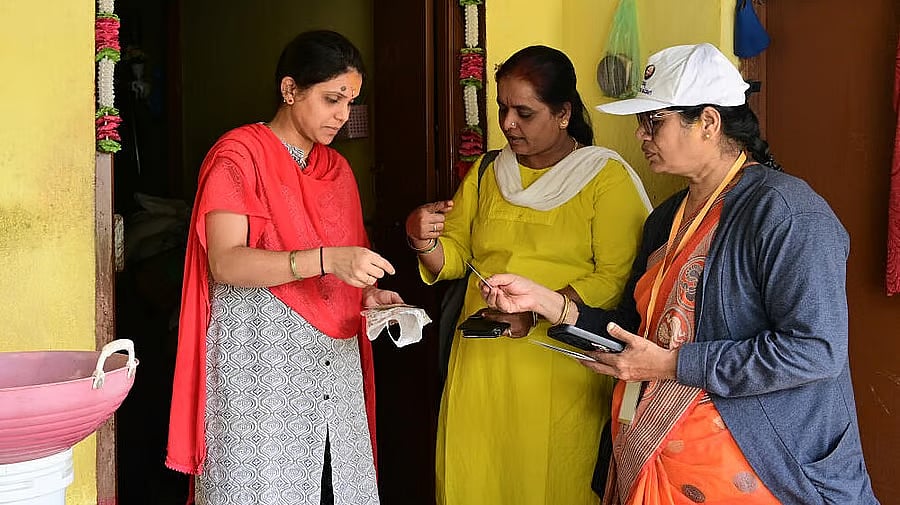 <div class="paragraphs"><p>Enumerators collecting details from a resident as part of the Social and Economic Survey.</p></div>