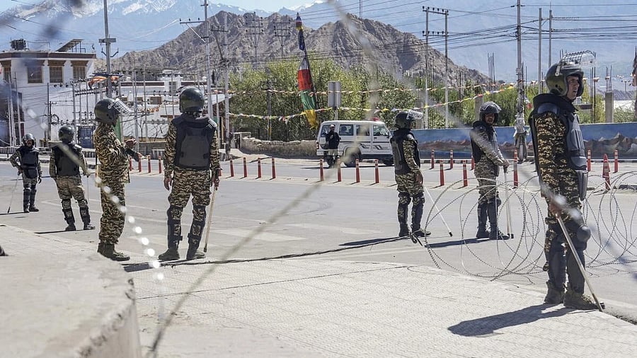 <div class="paragraphs"><p>Security personnel stand guard on a road amid curfew, days after violence during protests for Ladakh statehood, in Leh.</p></div>