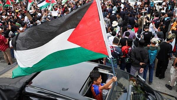 <div class="paragraphs"><p>A pro-Palestinian demonstrator waves a Palestinian flag.</p></div>