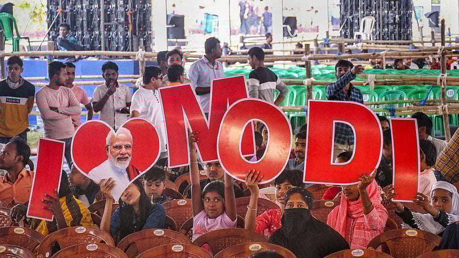 <div class="paragraphs"><p>Visitors hold placards to form 'I LOVE MODI'. (Image for representation)</p></div>