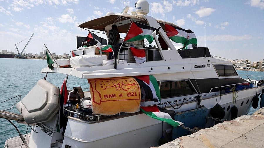 <div class="paragraphs"><p>People gather on a boat from a flotilla that had been carrying aid to Gaza until it was intercepted by Israel, docked in the port of Larnac</p><p></p></div>