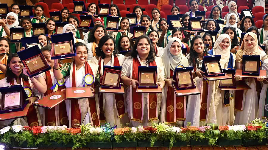 <div class="paragraphs"><p>Gold medal-winning students share their joy at the second and third convocations of the Maharani's Cluster University at Jnanajyothi Auditorium in Bengaluru on Friday. </p></div>