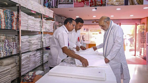 <div class="paragraphs"><p>Union Home Minister Amit Shah visits the 'Khadi India' on Gandhi Jayanti, in New Delhi.</p></div>
