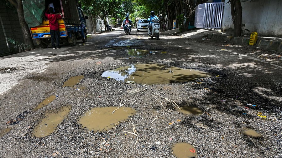 <div class="paragraphs"><p>Huge craters on a road in Sri Sai Layout, Vaddarapalya, Bengaluru. This picture was taken on Thursday, October 2.&nbsp;</p></div>