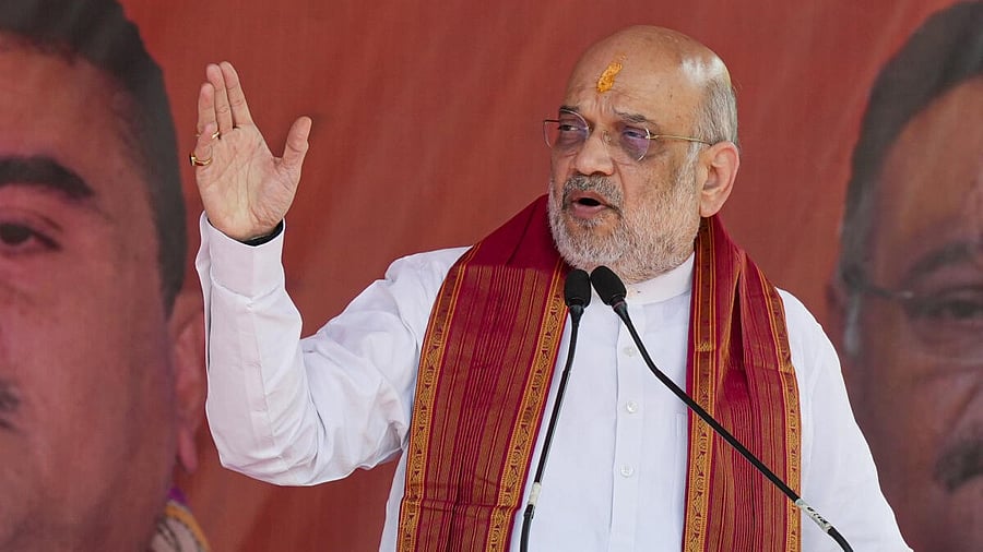<div class="paragraphs"><p>Union Home Minister Amit Shah addresses the gathering during the inauguration of a community puja pandal amid the ‘Durga Puja’ festivities, in Kolkata, Friday, Sept. 26, 2025.</p></div>