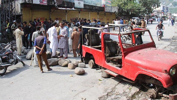 <div class="paragraphs"><p>Supporters of the Joint Awami Action Committee (JAAC)&nbsp;block a road during a protest following a shutter-down strike in Muzaffarabad.</p></div>