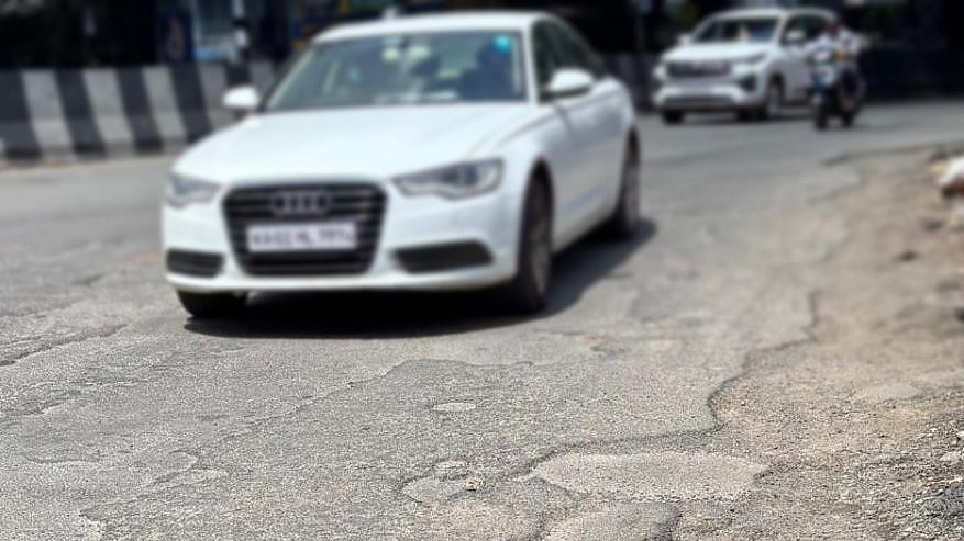 <div class="paragraphs"><p>Deep potholes dot Dr Rajkumar Road in Prakash Nagar. </p></div>