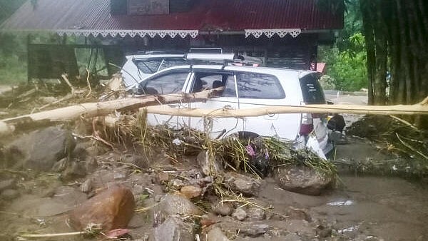 <div class="paragraphs"><p>Vehicles stuck in debris after landslides due to heavy rainfall, in Darjeeling district, West Bengal.</p></div>
