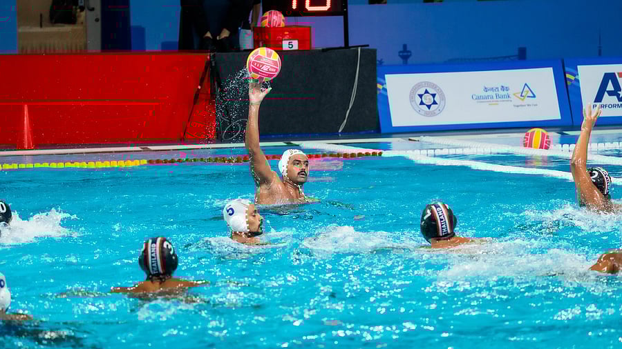 India’s Uday Utekar (with the ball) prepares to take a shot at goal against Thailand during their Group B match in Ahmedabad on Sunday.