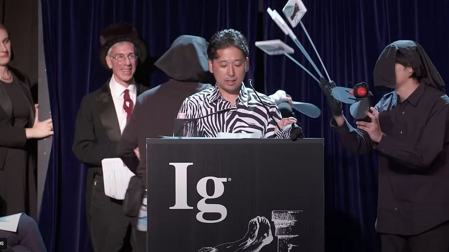 <div class="paragraphs"><p>The Ig Noble Prize winners for the Biology category giving a speech.</p></div>