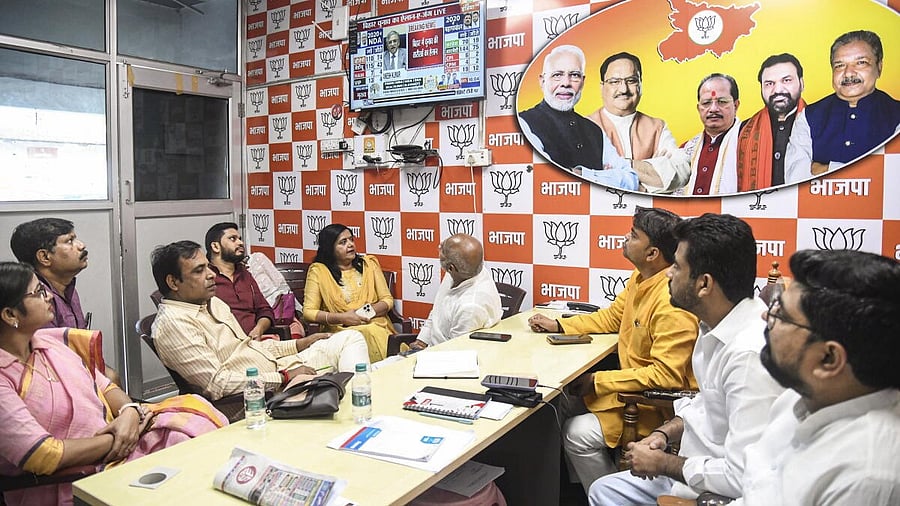 <div class="paragraphs"><p>BJP leaders watch live telecast of Election Commission's press conference.</p></div>