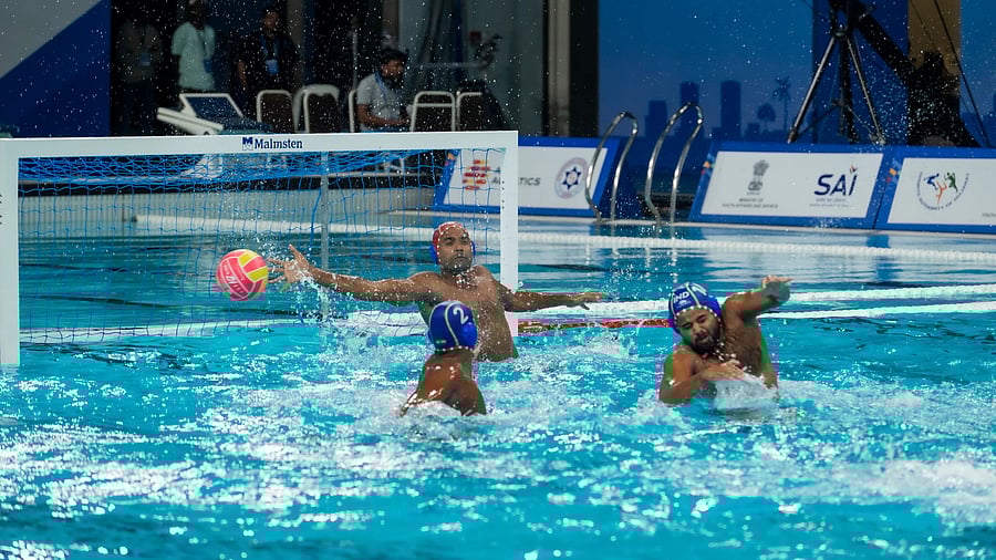 India's goalkeeper Tapas Mondal (centre) and defender Ankit Pasad (right) attempt in vain to stop a goal against Kazakhstan in Ahmedabad on Monday.