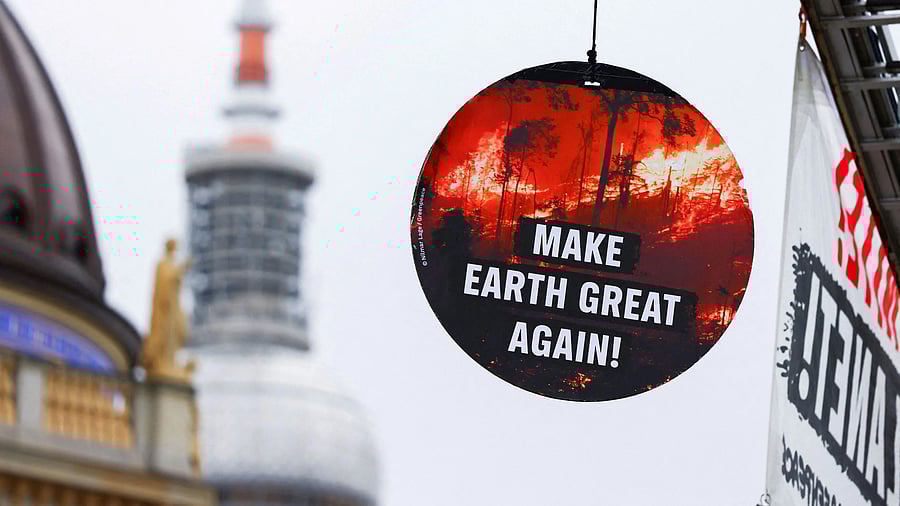 <div class="paragraphs"><p>A sign reading "Make Earth Great Again" hangs as Greenpeace activists demonstrate on the day of a conference at Germany's foreign ministry where officials from more than 190 signatory nations of the Paris Agreement meet to discuss the global fight against climate change in Berlin, Germany, March 26, 2025.</p></div>