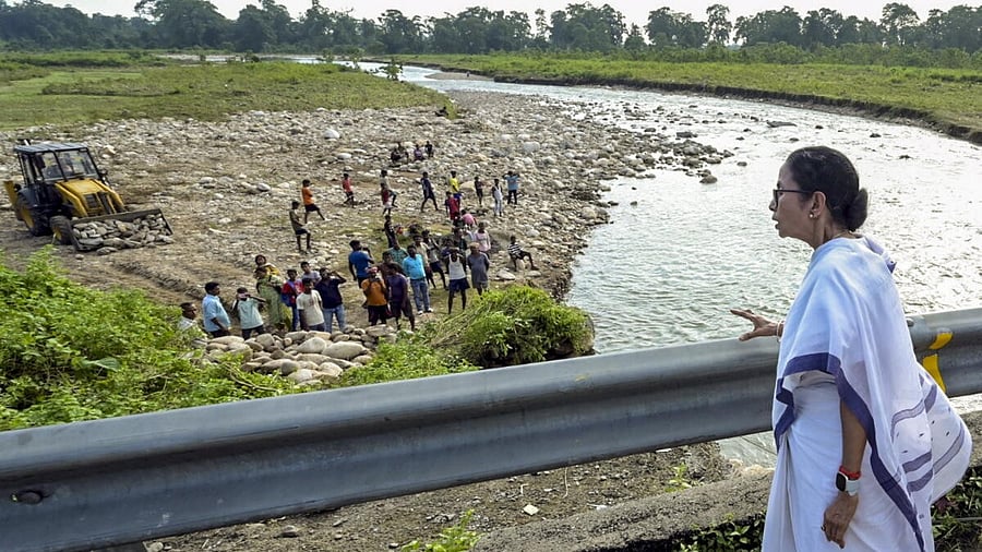 <div class="paragraphs"><p>West Bengal Chief Minister Mamata Banerjee interacts with residents of a flood-affected area, at Nagrakata in Jalpaiguri district, West Bengal.</p></div>