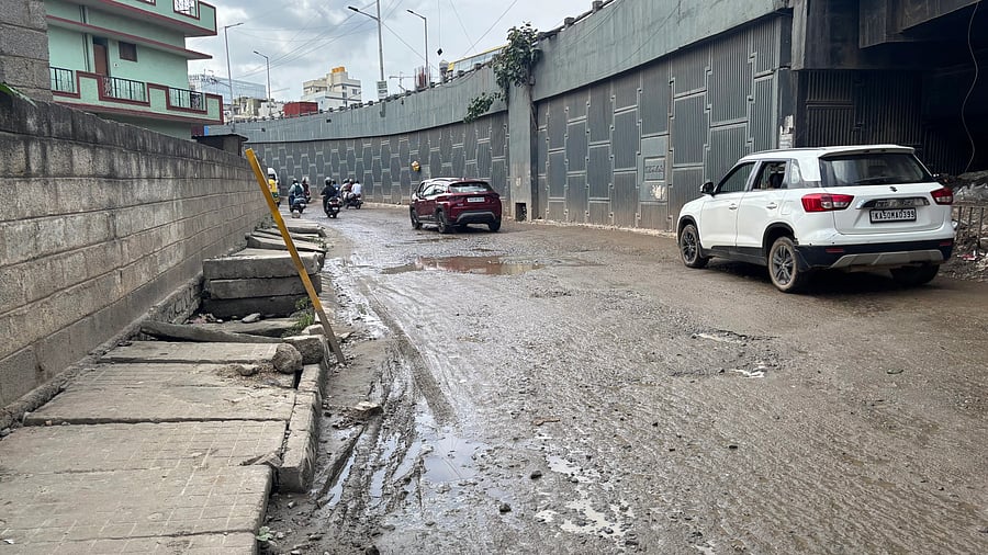 Commuters using this stretch at Nagawara spend a lot of time negotiating potholes. DH PHOTO/NAVEEN MENEZES 