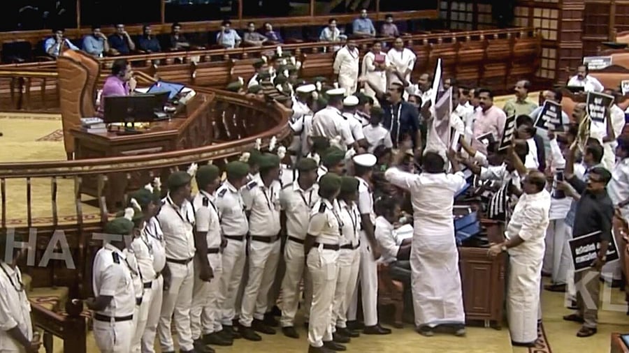 <div class="paragraphs"><p>Opposition members protesting over the Sabarimala temple gold plating controversy, in the&nbsp;Kerala Legislative Assembly on Wednesday.&nbsp;</p></div>