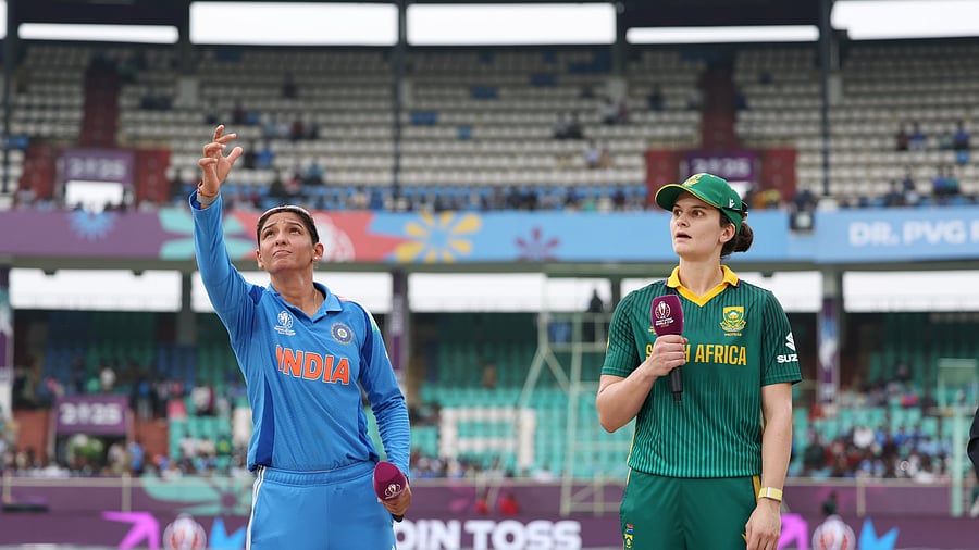 <div class="paragraphs"><p>Indian skipper Harmanpreet Kaur spins the coin as her South African counterpart Laura Wolvaardt watches on.</p></div>