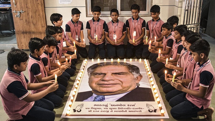 <div class="paragraphs"><p>Students light candles as they pay tribute to industrialist Ratan Tata on his death anniversary, in Surat.</p></div>