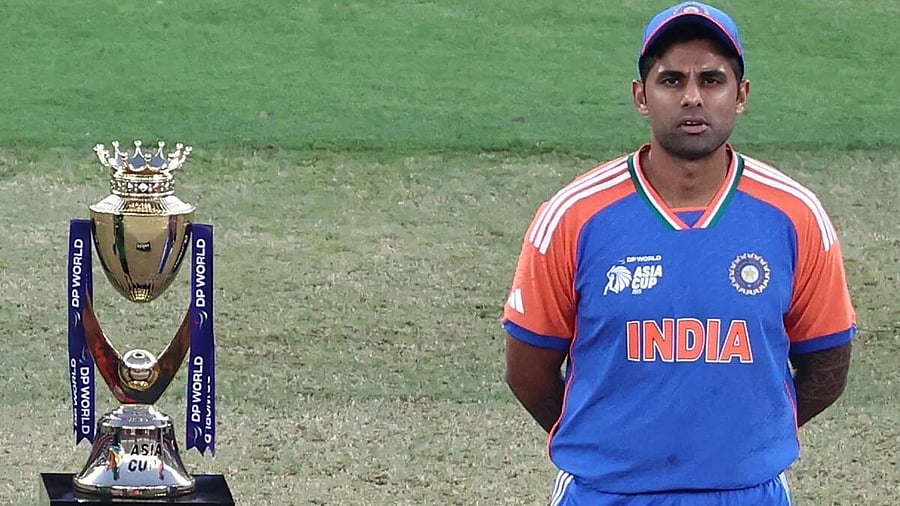 <div class="paragraphs"><p>India's captain Suryakumar Yadav stands near the Asia Cup trophy before the final against Pakistan in Dubai.</p></div>