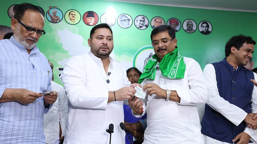 <div class="paragraphs"><p>RJD leader Tejashwi Yadav welcoming former JD(U) MP Santosh Kushwaha into the party fold on Friday.&nbsp;</p></div>