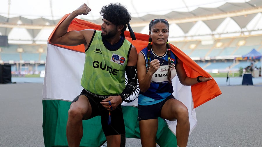 <div class="paragraphs"><p>World Para Athletics Championships New Delhi 2025 - Jawaharlal Nehru Stadium, New Delhi, India - October 5, 2025 India's Simran and guide Umar Saifi celebrate after winning silver in the Women's 200m T12 final. Credit: Reuters</p></div>