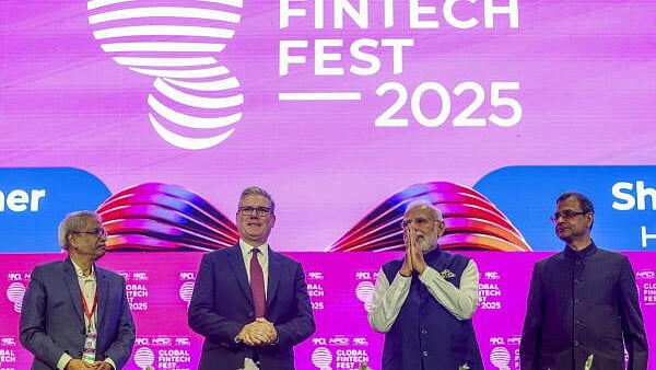 <div class="paragraphs"><p>Prime Minister Narendra Modi with his British counterpart Keir Starmer, Reserve Bank of India (RBI) Governor Sanjay Malhotra and others during the ‘Global Fintech Fest 2025’.</p></div>
