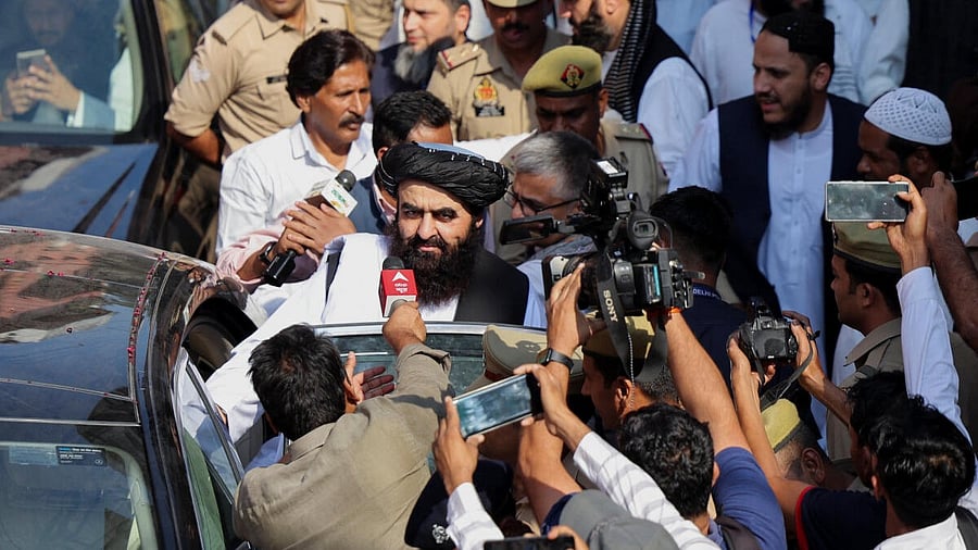 <div class="paragraphs"><p>Taliban Foreign Minister Mawlawi Amir Khan Muttaqi gives interviews to media outside the guest house near the Darul Uloom Deoband, an Islamic seminary, in Deoband, Uttar Pradesh, October 11, 2025.</p></div>