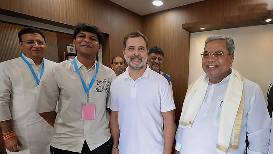Dhawan Rakesh seen with Congress leader Rahul Gandhi, grandfather Chief Minister Siddaramaiah and AICC general secretary Randeep Singh Surjewala on the sidelines of the ‘vote adhikar rally’, in Bengaluru on August 8.