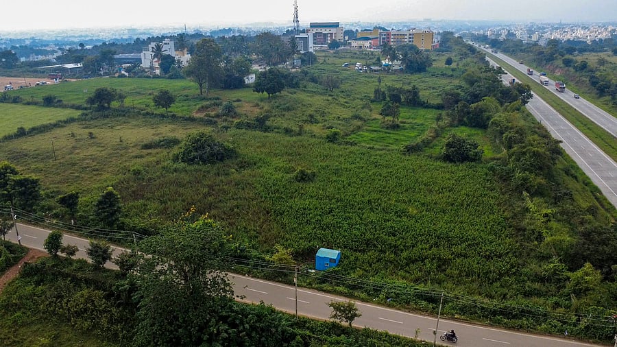 <div class="paragraphs"><p>An aerial view of a parcel of land near NICE Road, Bengaluru, allegedly grabbed through illegal means.&nbsp;</p></div>