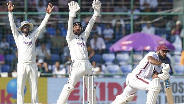 <div class="paragraphs"><p>India's wicketkeeper Dhruv Jurel, center, and KL Rahul, left, appeal unsuccessfully for the wicket of West Indies’ John Campbell on day three of the second and final Test cricket match of a series between India and West Indies, in New Delhi.</p></div>