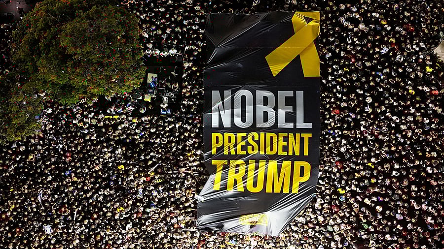 <div class="paragraphs"><p>A drone photo of people gathering in "Hostages square" as they hold up a giant sign with the words "NOBEL PRESIDENT TRUMP" written on it.</p></div>
