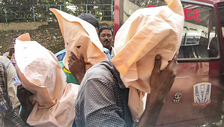 <div class="paragraphs"><p>Police officials arrest men allegedly involved in the gang rape of a second-year MBBS student from Odisha at a private medical college, in Durgapur, West Bengal, Sunday, Oct. 12, 2025.</p></div>
