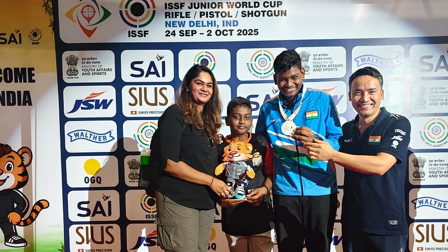 Jonathan Antony (second from right), celebrates his gold medal at the Junior Shooting World Cup in New Delhi with his mother Ancy Alphonse (left), brother Johan and coach Jitu Rai (right). 