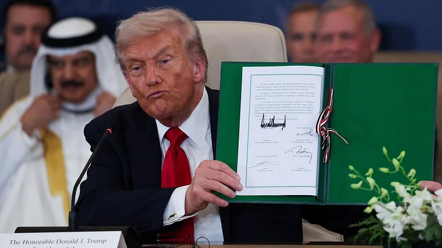<div class="paragraphs"><p>President Donald Trump poses with the signed agreement at a world leaders' summit on ending the Gaza war, amid a U.S.-brokered prisoner-hostage swap and ceasefire deal between Israel and Hamas, in Sharm el-Sheikh, Egypt, October 13, 2025.</p></div>