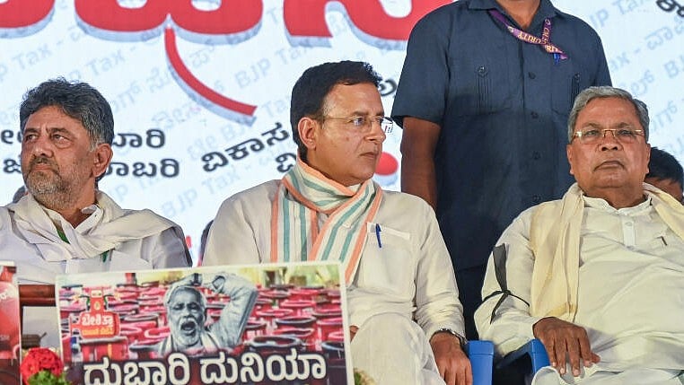 <div class="paragraphs"><p>Karnataka CM Siddaramaiah, D K Shivakumar and party leader Randeep Singh Surjewala</p></div>