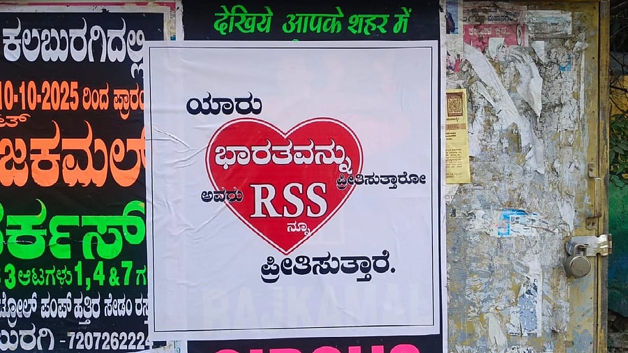 A poster hailing the RSS was pasted by the BJP on a roadside wall in Kalaburagi on Monday. DH PHOTO
