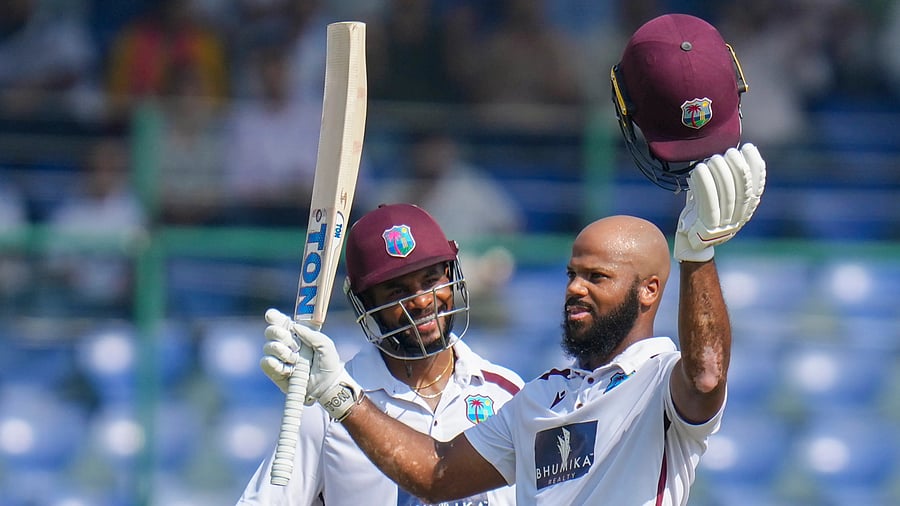 <div class="paragraphs"><p>West Indies' John Campbell celebrates his century as Shai Hope looks on </p></div>