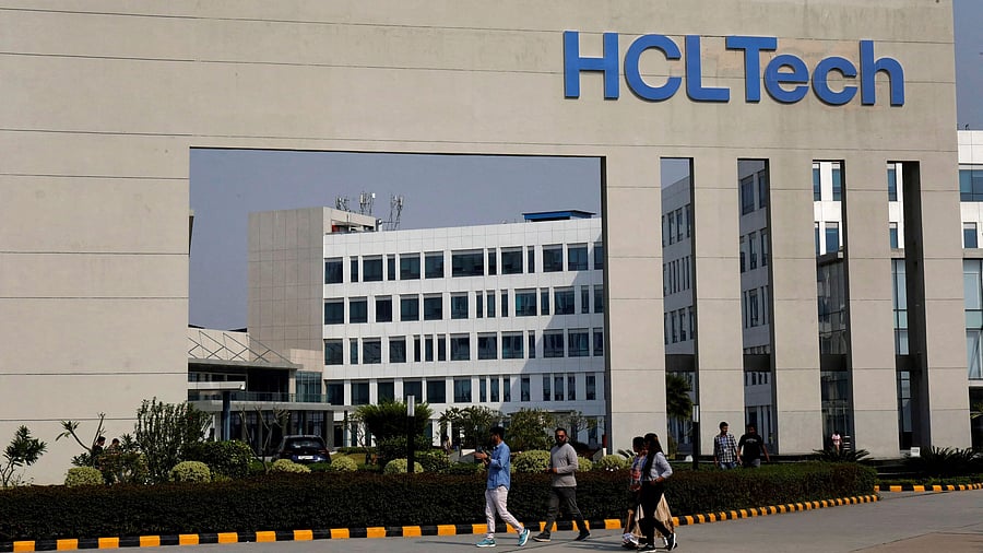 <div class="paragraphs"><p>Employees of HCLTech walk inside the office premises.</p></div>
