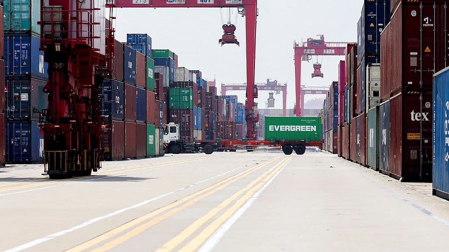 <div class="paragraphs"><p> Gantry cranes stand near shipping containers at Yangshan Port outside of Shanghai, China.</p></div>